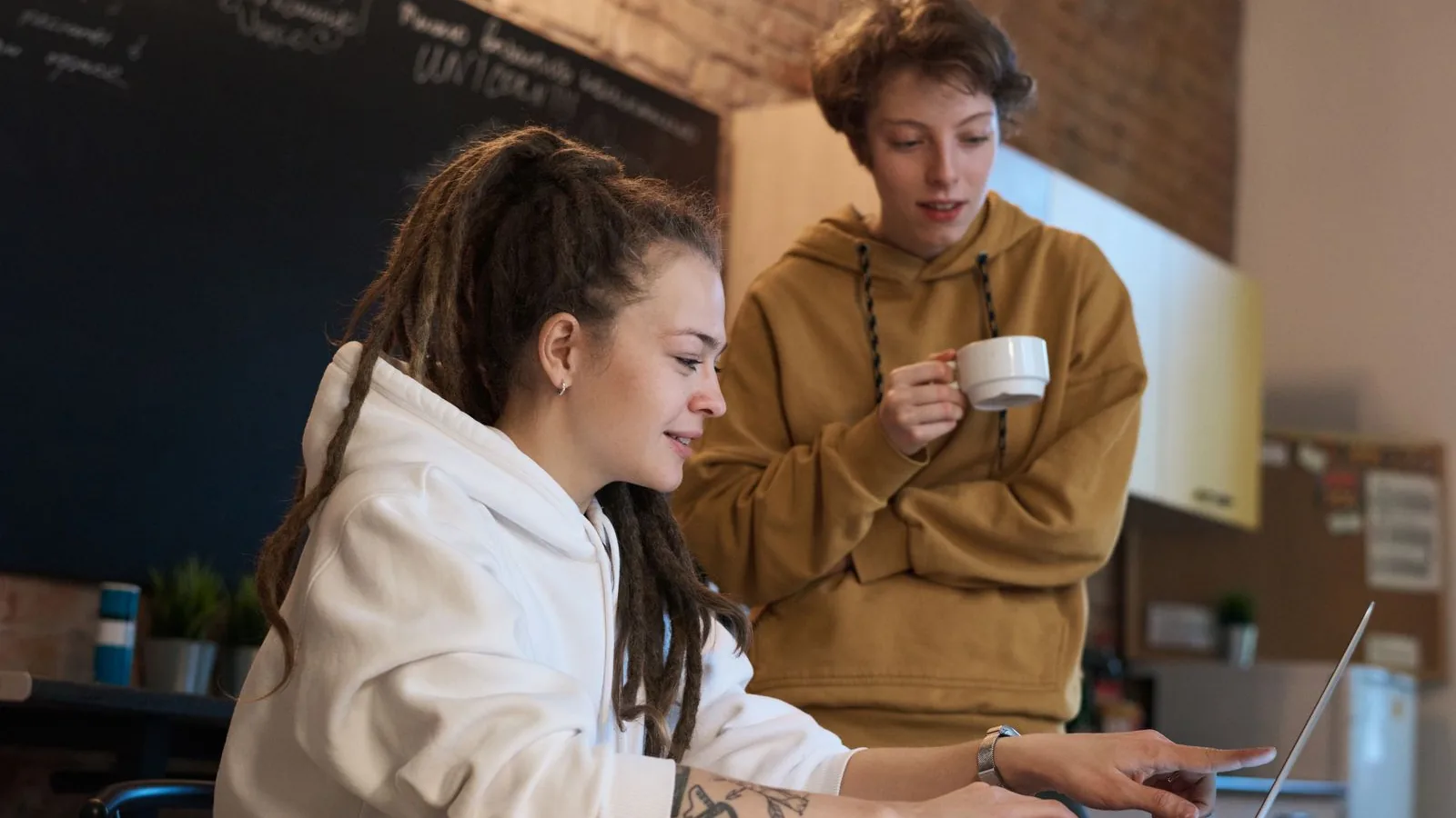 Two people reviewing a small business website