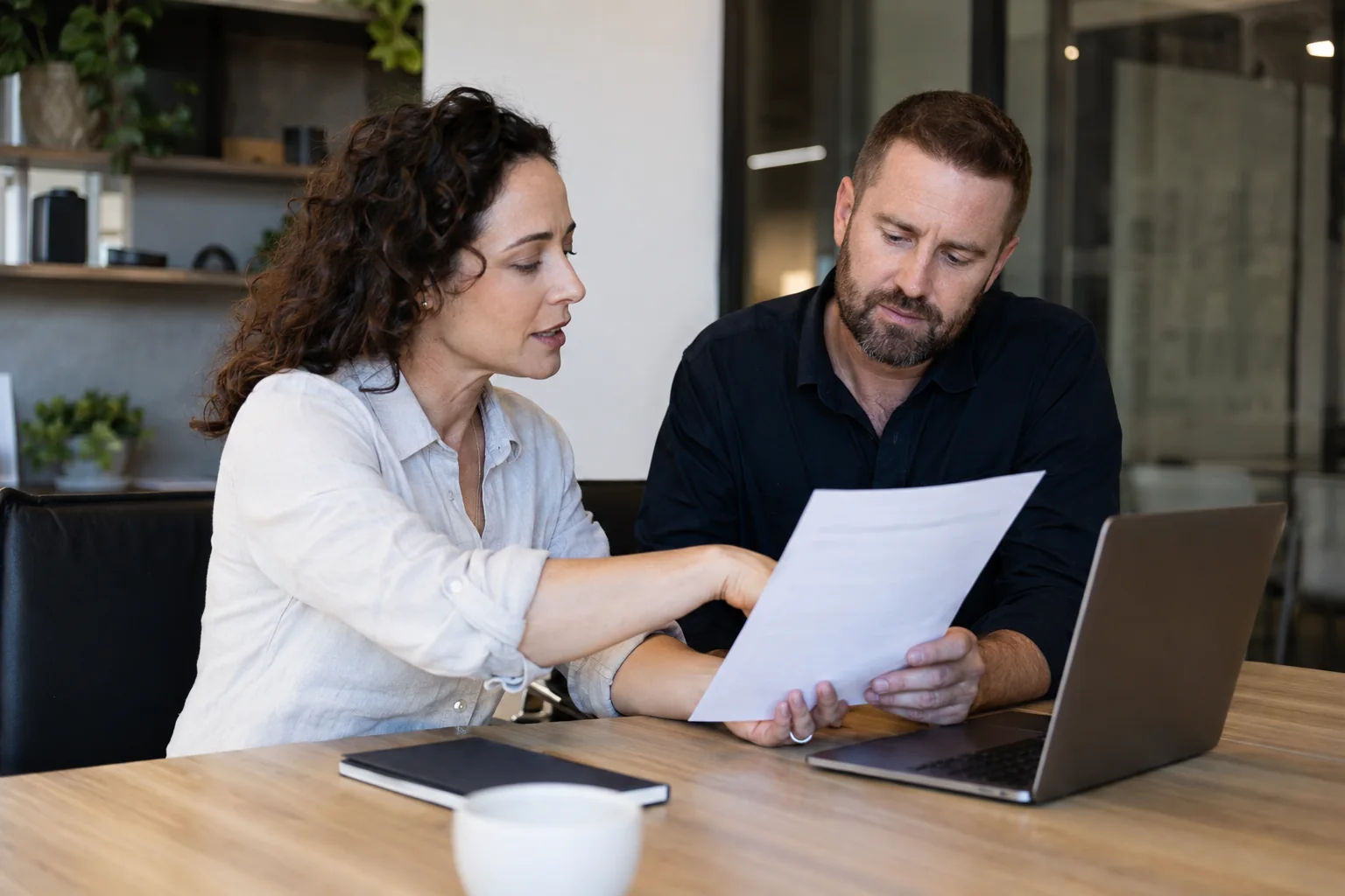 Business managers reviewing a customer-feedback policy together